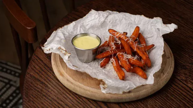 Sweet potato fries with parmesan and aioli sauce