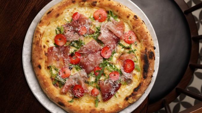 Truffle pizza with fenugreek and prosciutto
